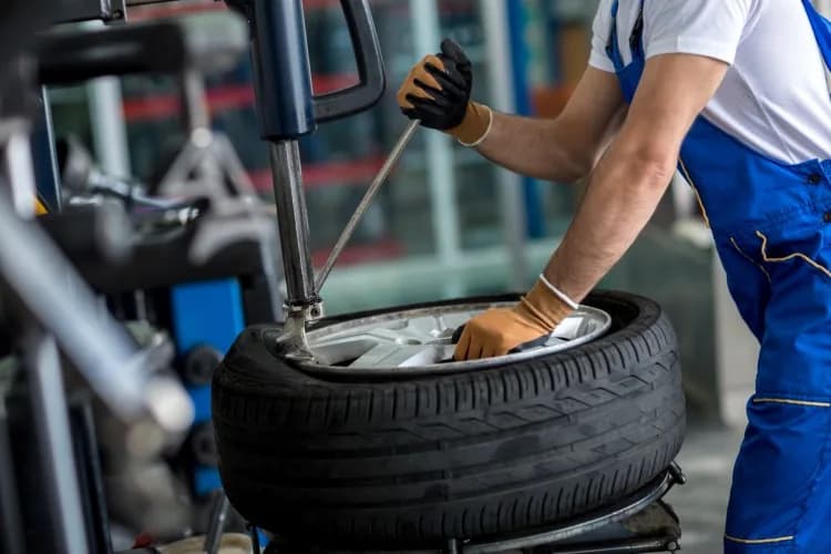 A tyre being fitted on a tyre changing machine