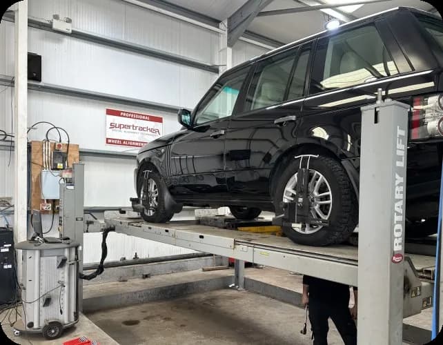 Vehicle on Supertracker wheel alignment rig at P&L Haile, Wigton